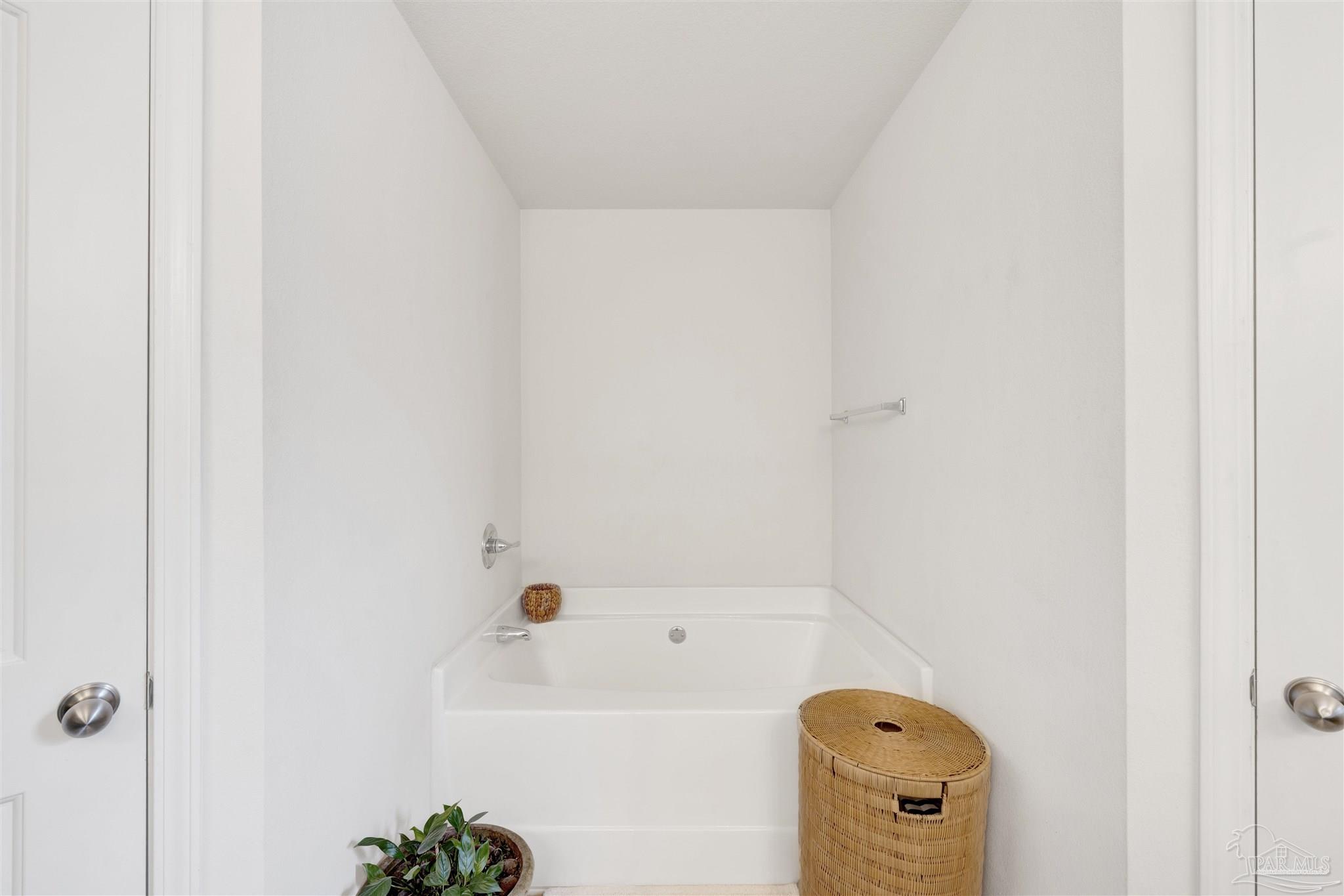 213 Millet Circle Cantonment, FL 32533 - Photo 21 of 33 a bathroom with a bath tub