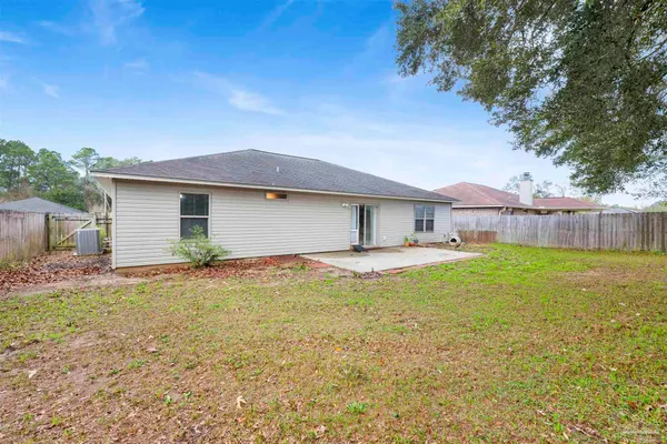 a view of a house with a yard and garage