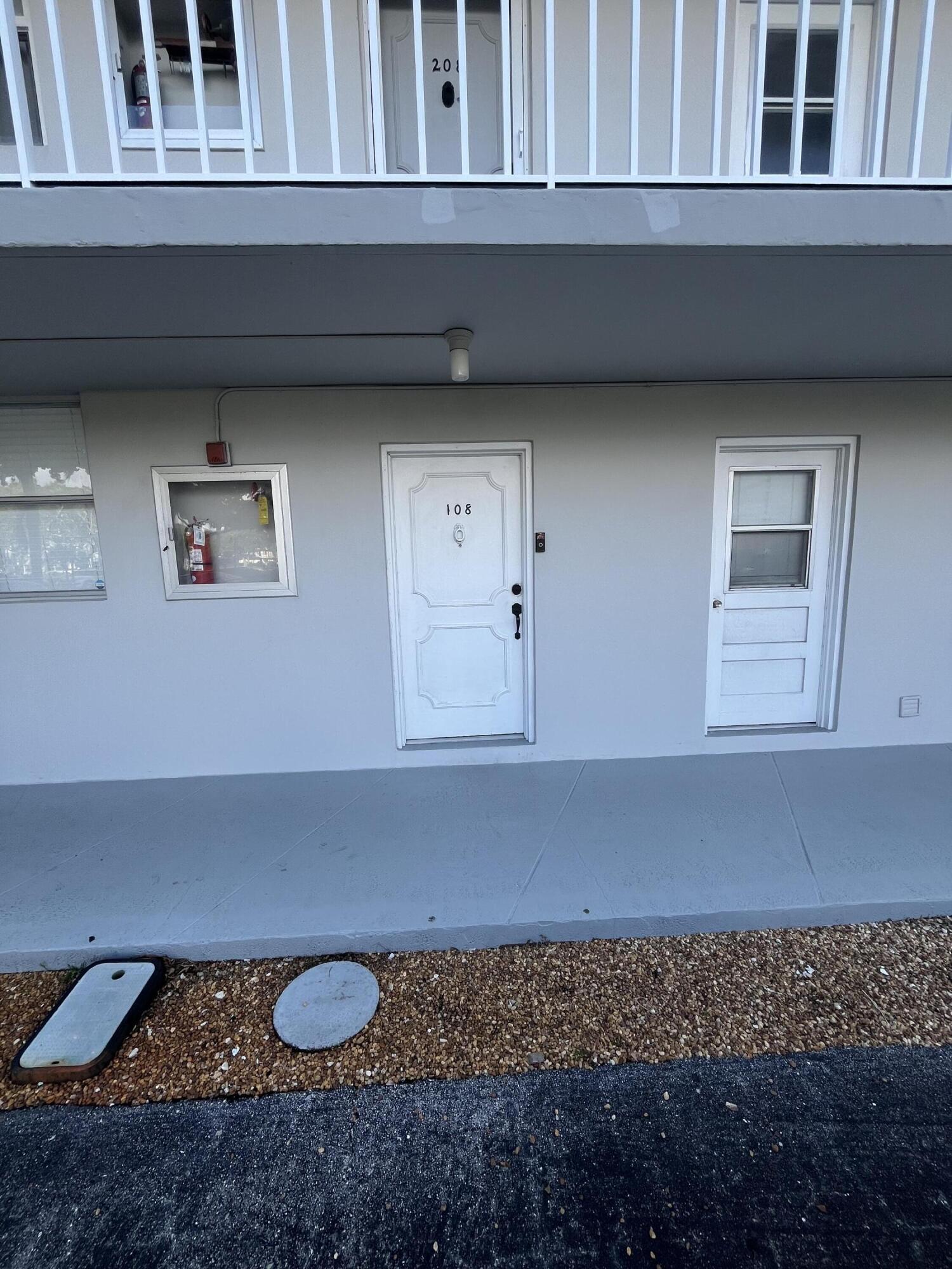 5961 Northwest 2nd Avenue, Unit 108 Boca Raton, FL 33487 - Photo 2 of 25 5961 front door 026