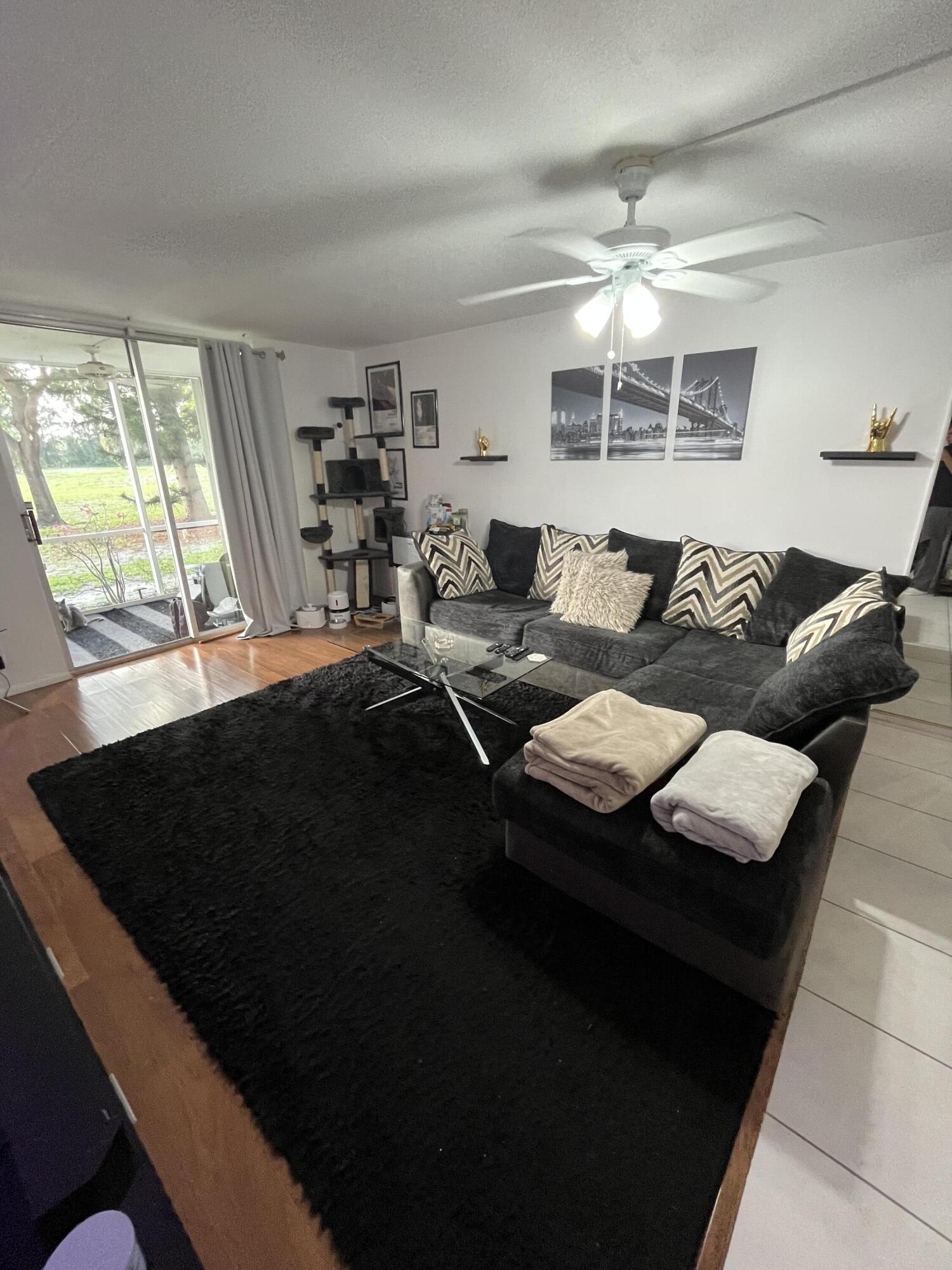 5961 Northwest 2nd Avenue, Unit 108 Boca Raton, FL 33487 - Photo 3 of 25 5961 living room 1