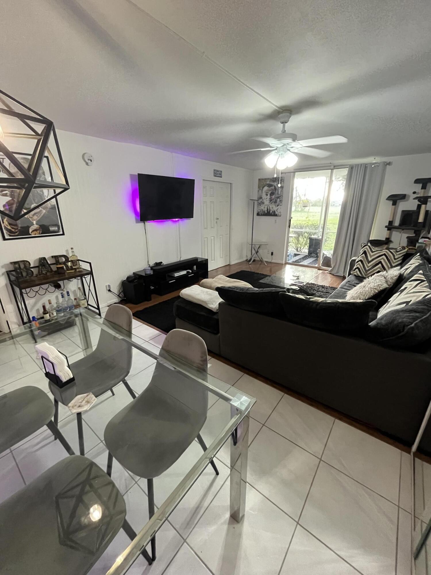 5961 Northwest 2nd Avenue, Unit 108 Boca Raton, FL 33487 - Photo 4 of 25 5961 living room 2