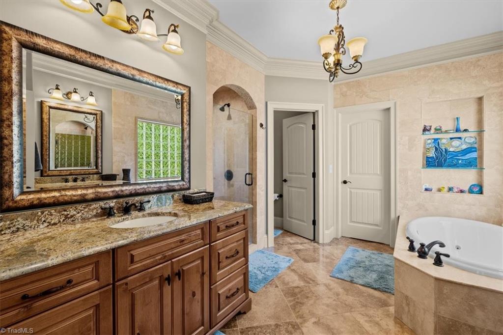 7787 Sutter Road Greensboro, NC 27455 - Photo 24 of 50 Primary bathroom ensuite to fall in love with!