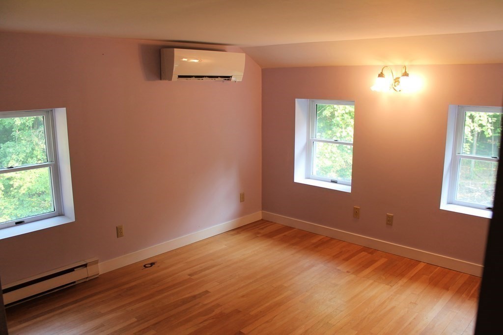88 Groton Road Shirley, MA 01464 - Photo 21 of 30 an empty room with wooden floor and windows