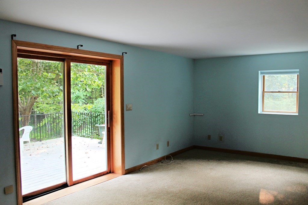 88 Groton Road Shirley, MA 01464 - Photo 4 of 30 a view of an empty room with a window