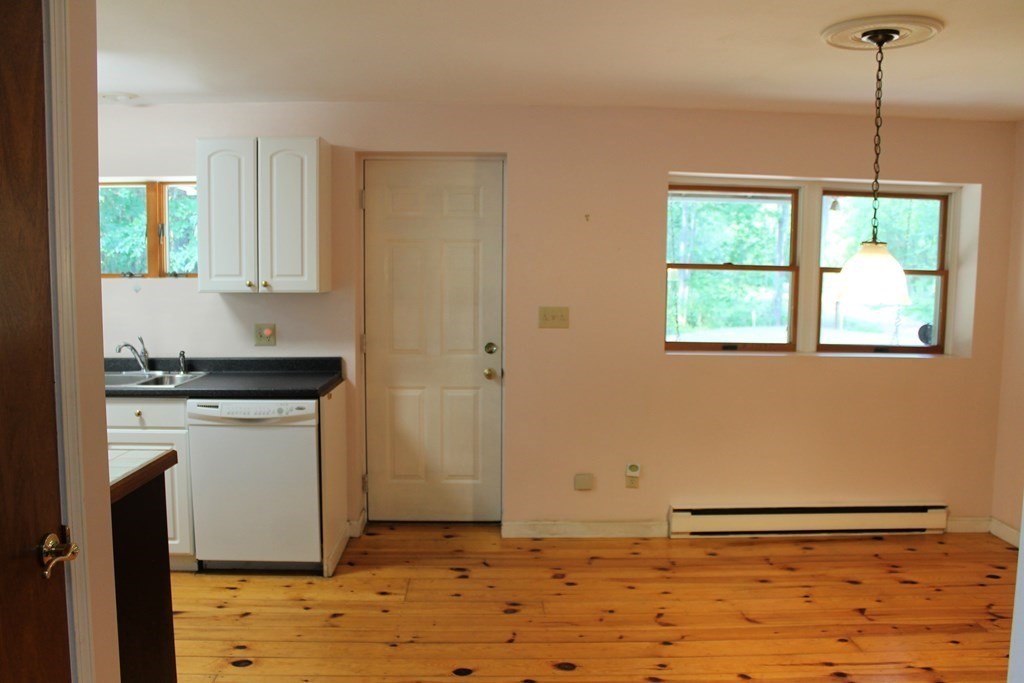 88 Groton Road Shirley, MA 01464 - Photo 6 of 30 a kitchen with a stove and a refrigerator