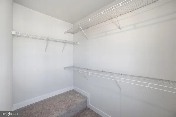 a view of a room with racks on the wall