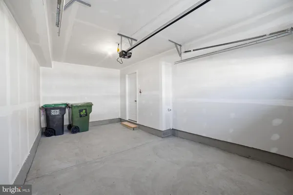 a view of a garage with wooden floor