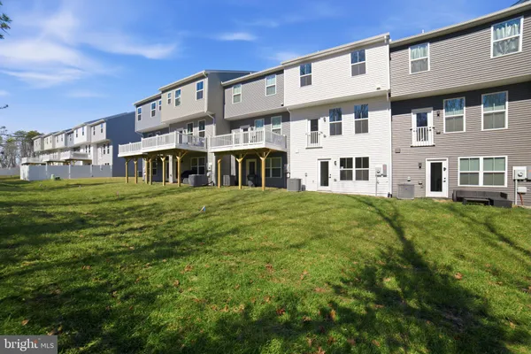 a view of a building with a yard