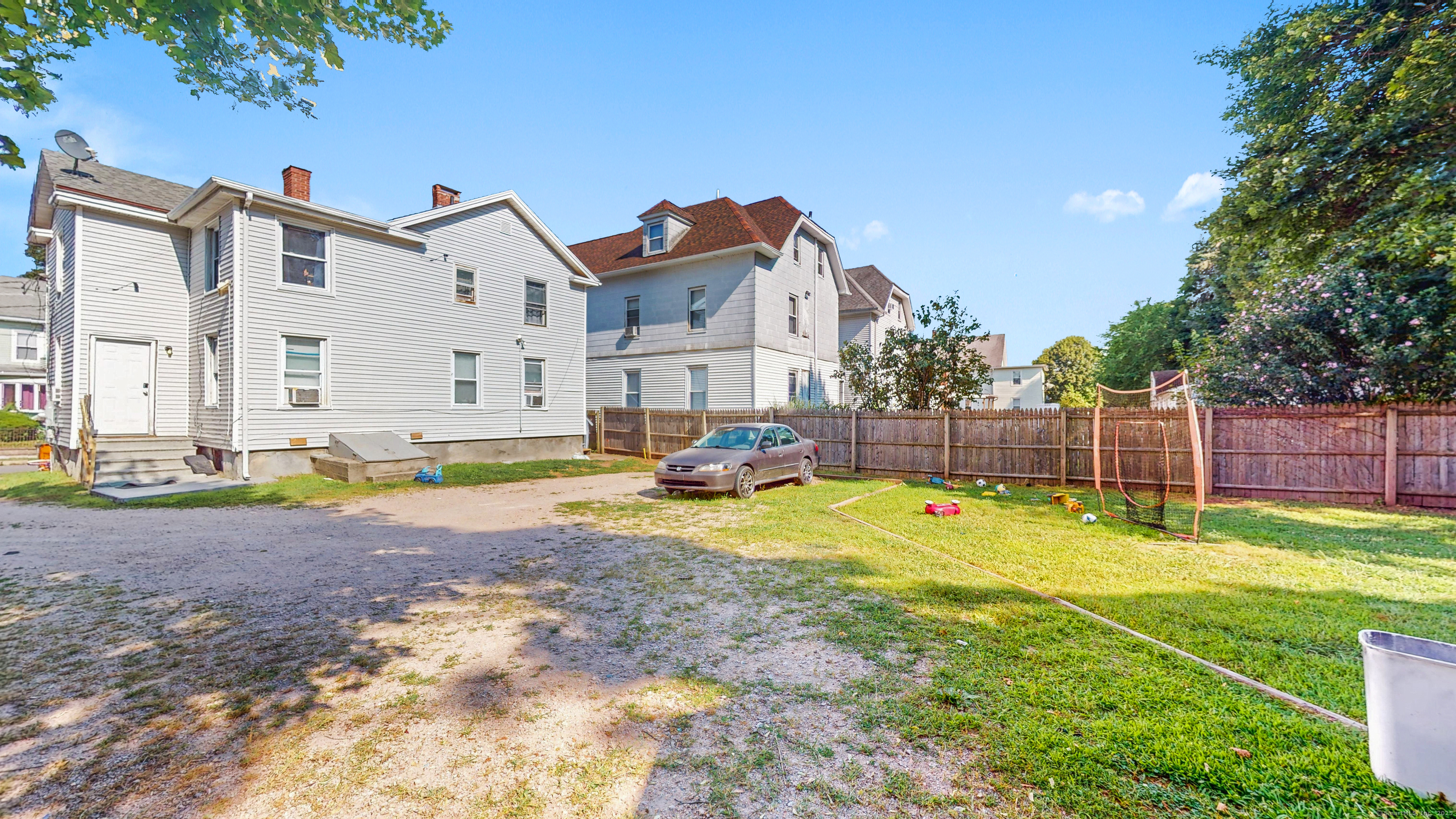 a view of a house with swimming pool and yard