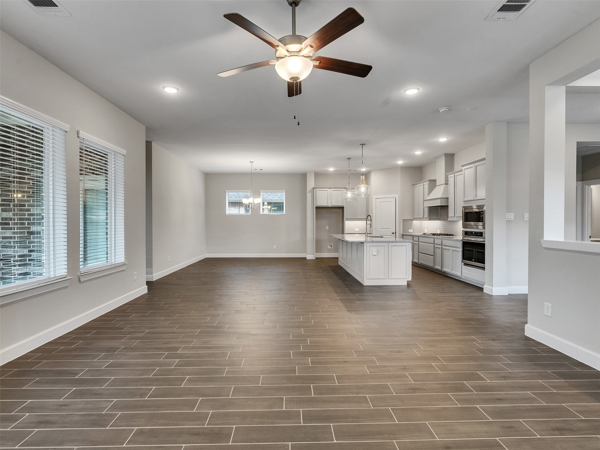 7003 Goldstrum Way Katy, TX 77493 - Photo 13 of 44 a view of an empty room with kitchen and window