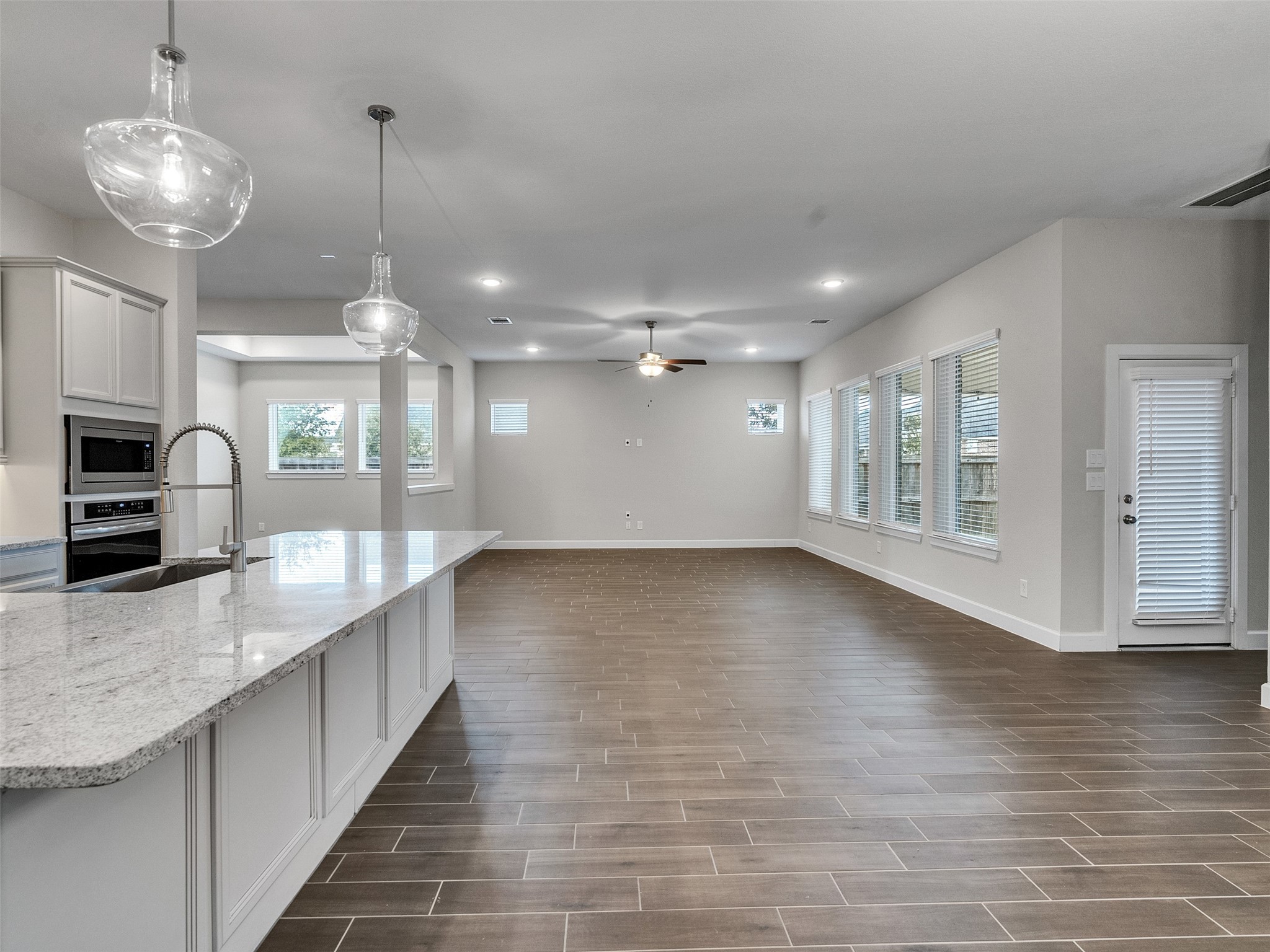 7003 Goldstrum Way Katy, TX 77493 - Photo 18 of 44 a view of a kitchen with a sink and chandelier
