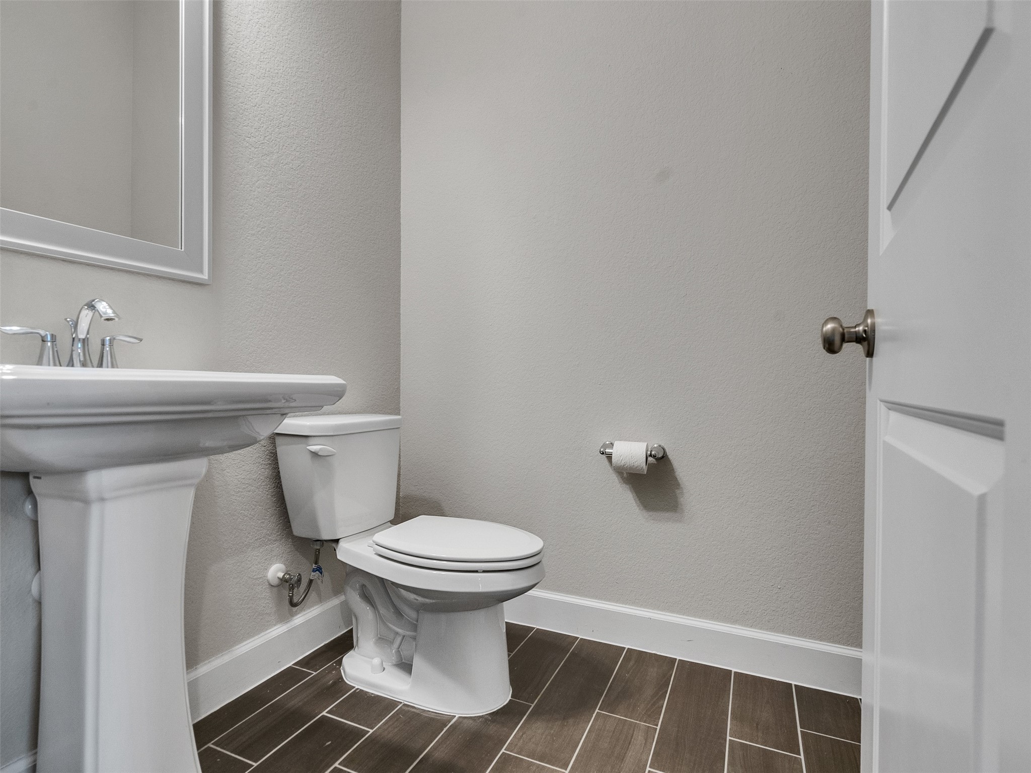 7003 Goldstrum Way Katy, TX 77493 - Photo 27 of 44 a bathroom with a sink toilet and a mirror