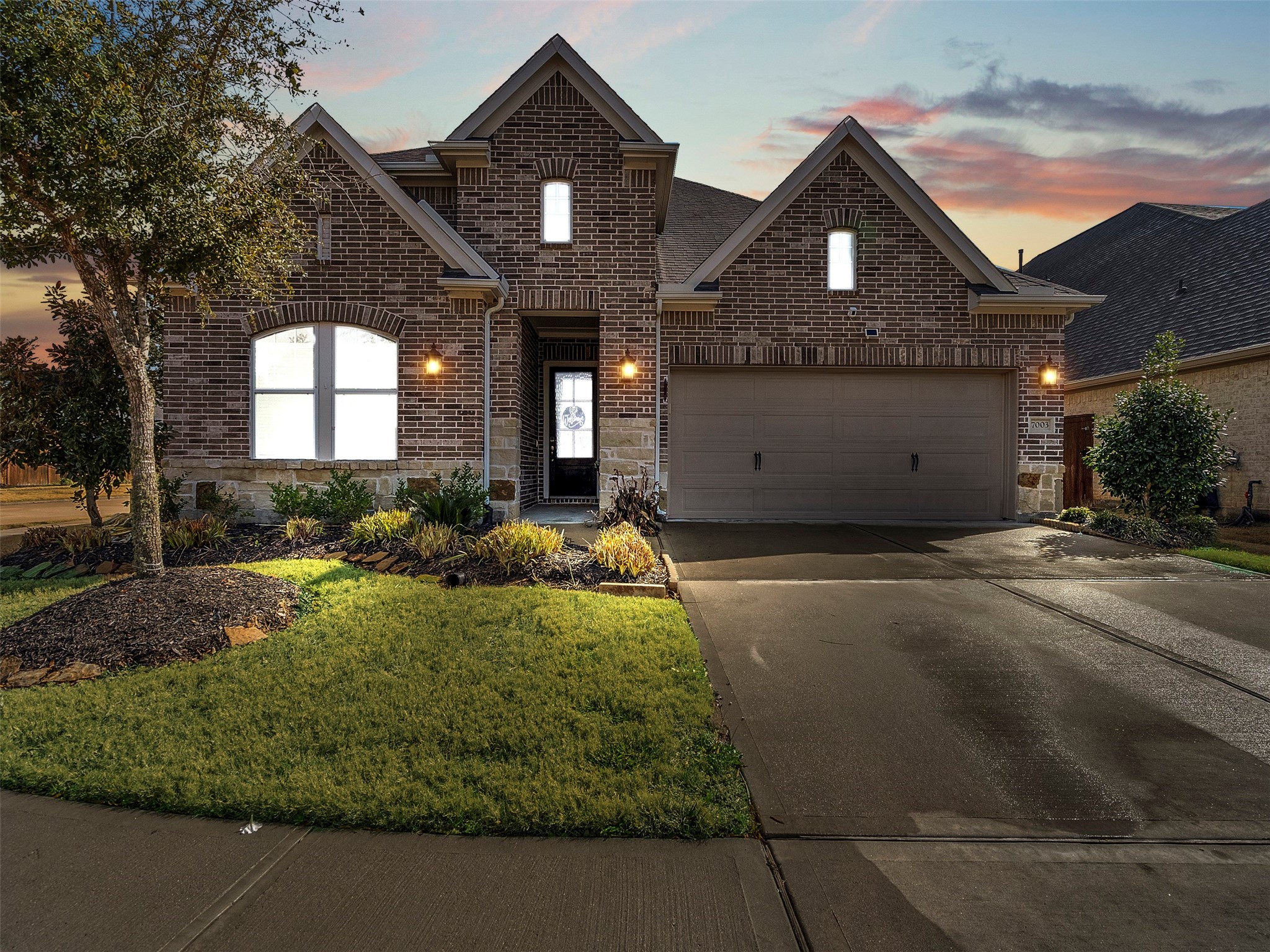 7003 Goldstrum Way Katy, TX 77493 - Photo 36 of 44 a front view of a house with a yard and garage