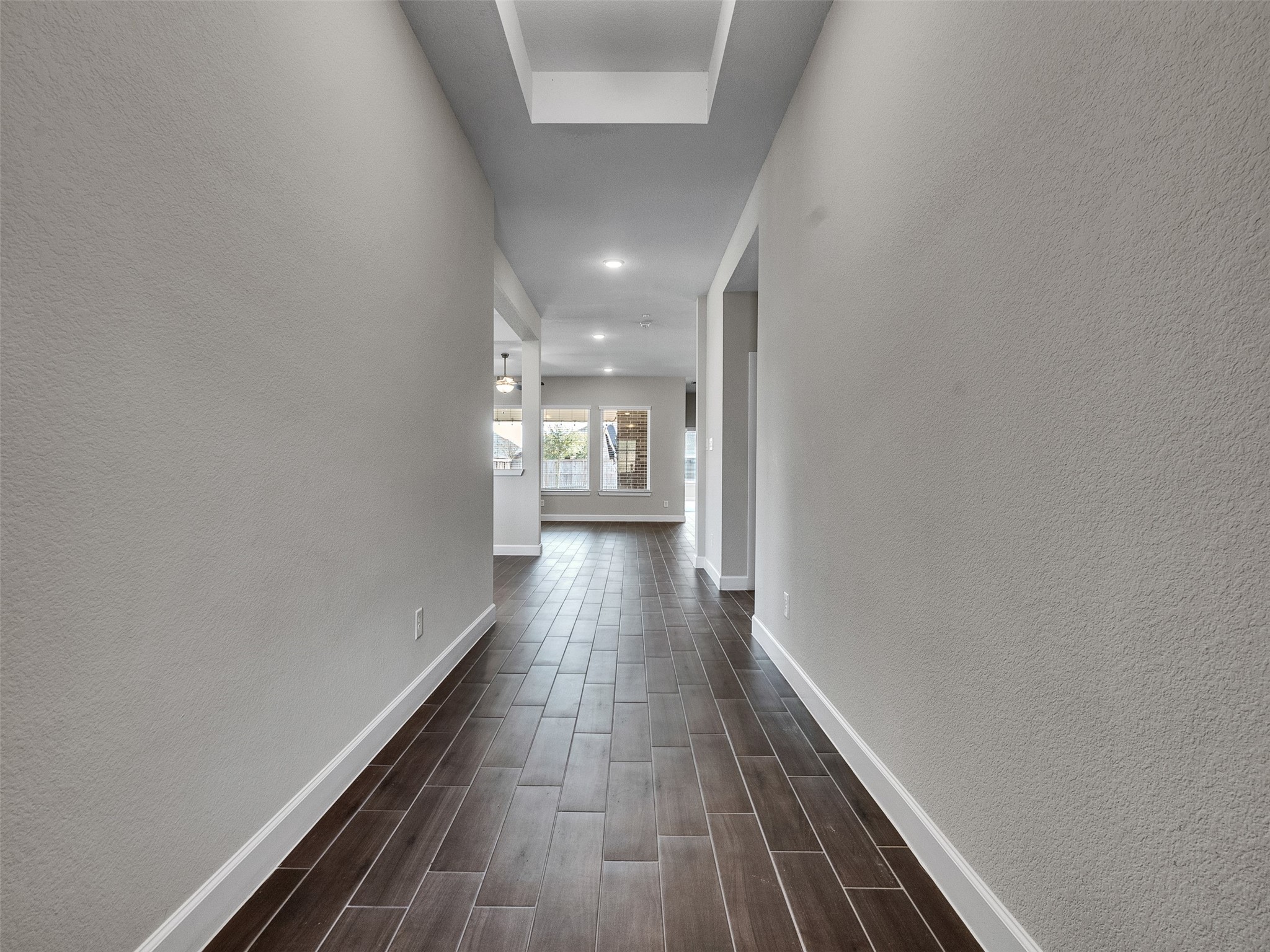 7003 Goldstrum Way Katy, TX 77493 - Photo 6 of 44 a view of a hallway with wooden floor