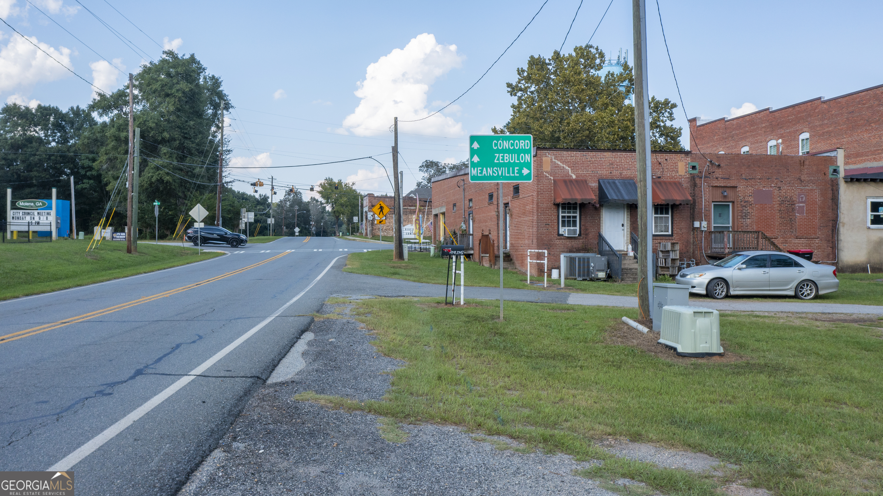 0 Ga Highway Molena, GA 30258 - Photo 26 of 27 a front view of a house with a yard table and chairs