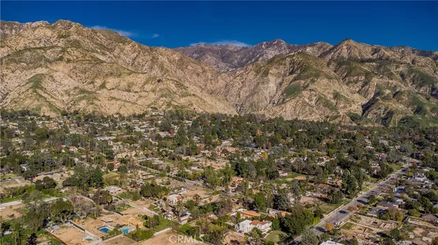 an aerial view of a houses with outdoor space