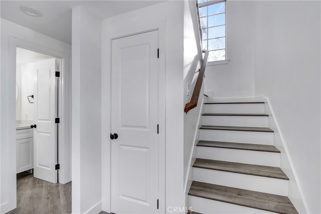 26311 Misty Glen, Unit 3 Lake Forest, CA 92630 - Photo 12 of 27 a view of entryway with wooden floor and staircase