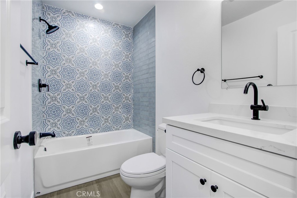 26311 Misty Glen, Unit 3 Lake Forest, CA 92630 - Photo 18 of 27 a bathroom with a sink a toilet and a bathtub