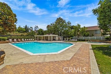 26311 Misty Glen, Unit 3 Lake Forest, CA 92630 - Photo 25 of 27 a view of a swimming pool with a yard
