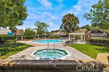 26311 Misty Glen, Unit 3 Lake Forest, CA 92630 - Photo 26 of 27 a swimming pool with outdoor seating and garden