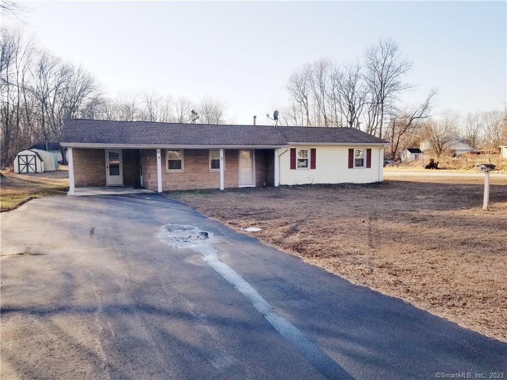 a front view of a house with yard