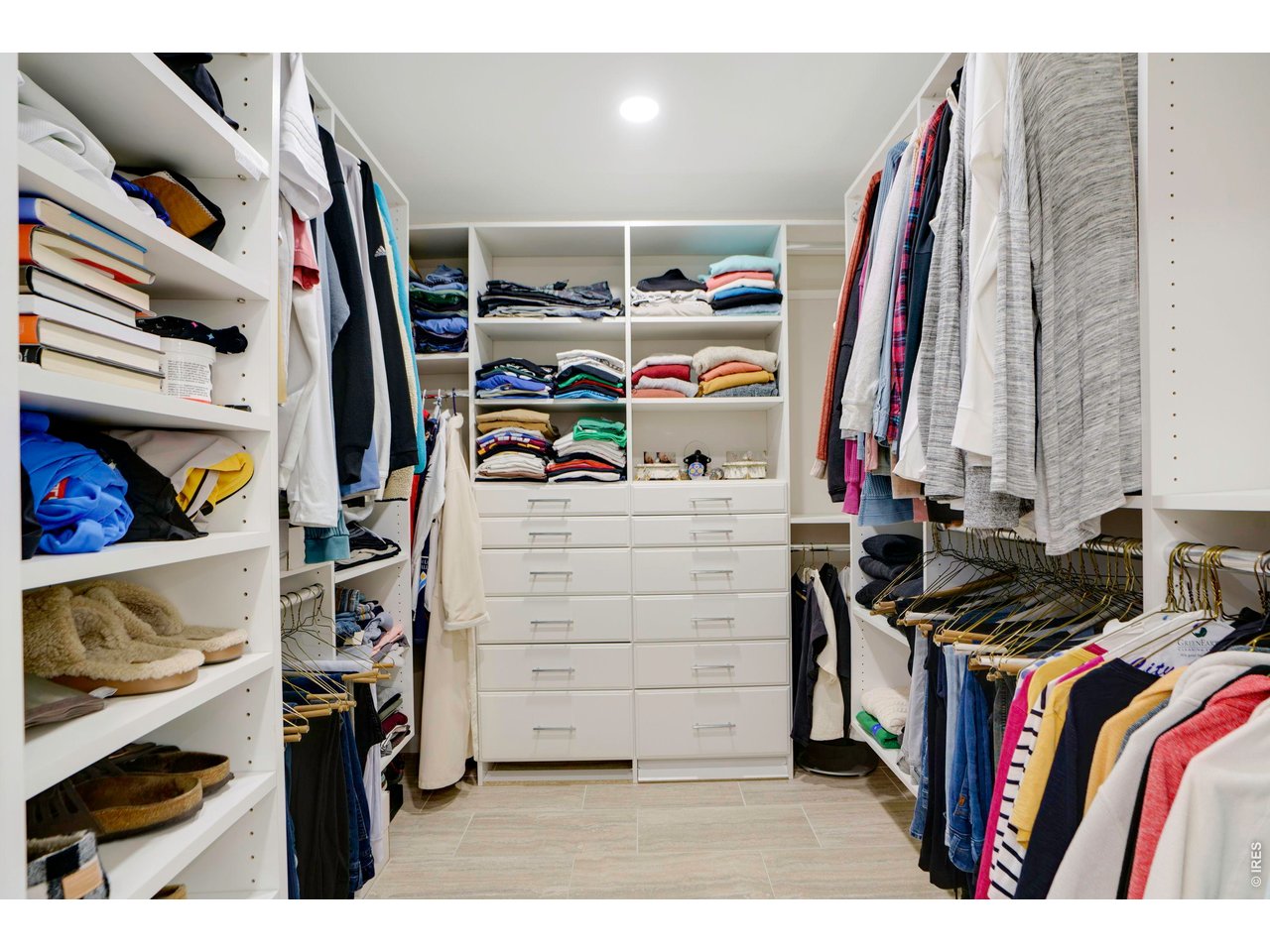 19 Ridge Road Boulder, CO 80303 - Photo 24 of 42 a view of walk in closet with clothes and shoes