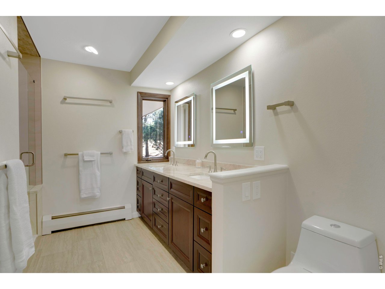 19 Ridge Road Boulder, CO 80303 - Photo 25 of 42 a bathroom with a granite countertop sink mirror and double