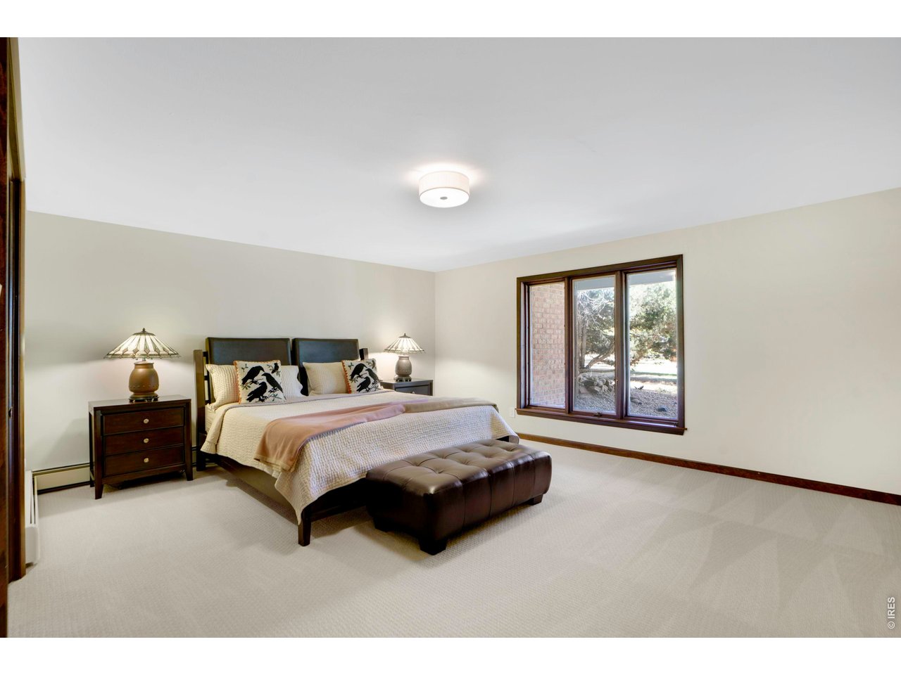 19 Ridge Road Boulder, CO 80303 - Photo 35 of 42 a spacious bedroom with a bed and a window