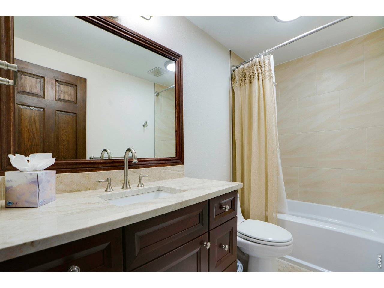 19 Ridge Road Boulder, CO 80303 - Photo 36 of 42 a bathroom with a sink a toilet a mirror and shower