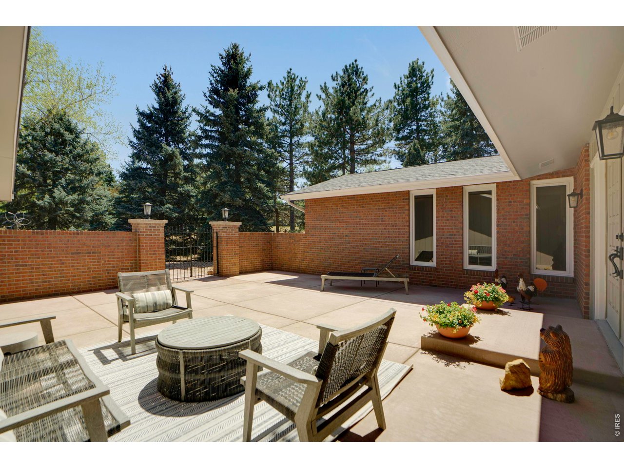 19 Ridge Road Boulder, CO 80303 - Photo 5 of 42 a view of a patio with table and chairs with wooden floor and fence