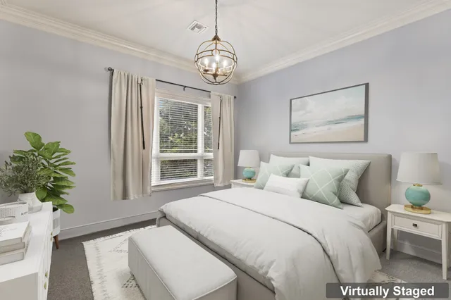 a bedroom with bed and a window