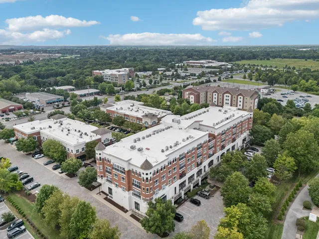 an aerial view of a multi story parking space