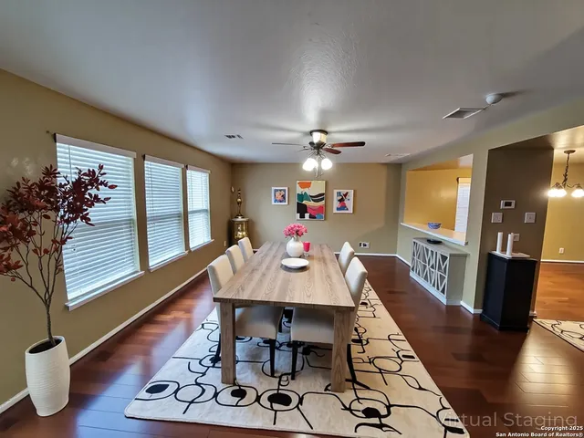 a view of a dining room with furniture window and wooden floor