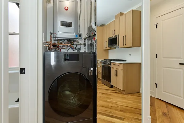a view of a kitchen cabinets and wooden floor