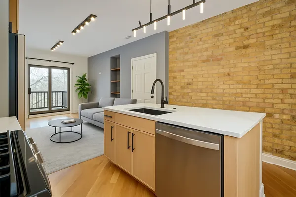 a bathroom with a granite countertop sink mirror and double