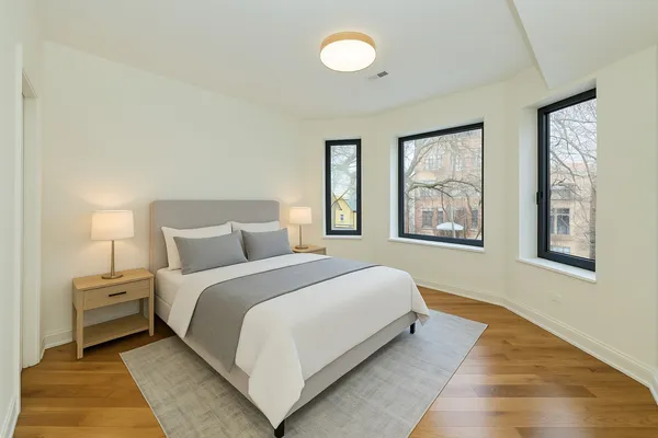 a bed room with a bed and a painting