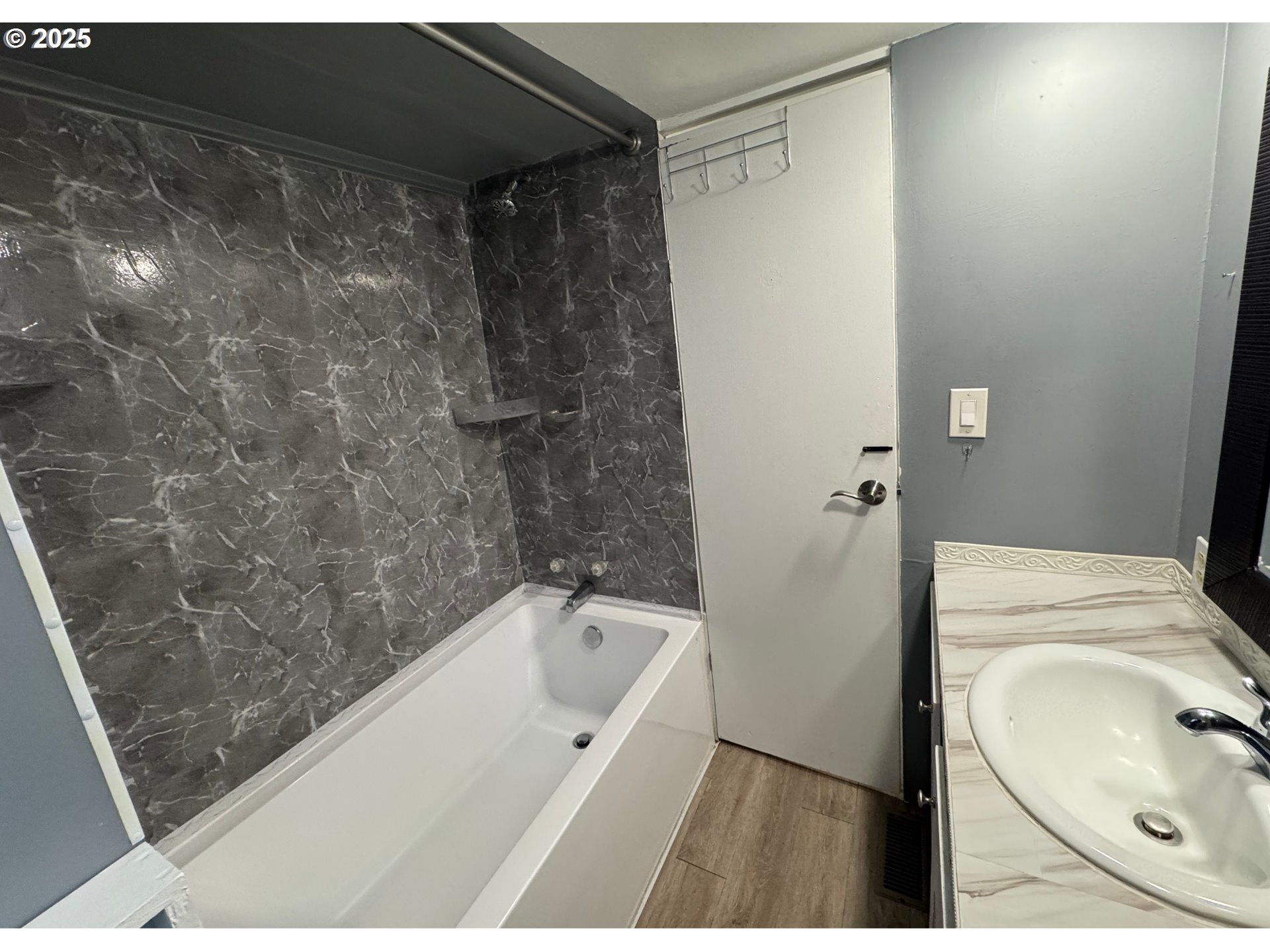 1215 Southwest 11th Street, Unit 112 Hermiston, OR 97838 - Photo 12 of 14 a bathroom with a bathtub and a toilet