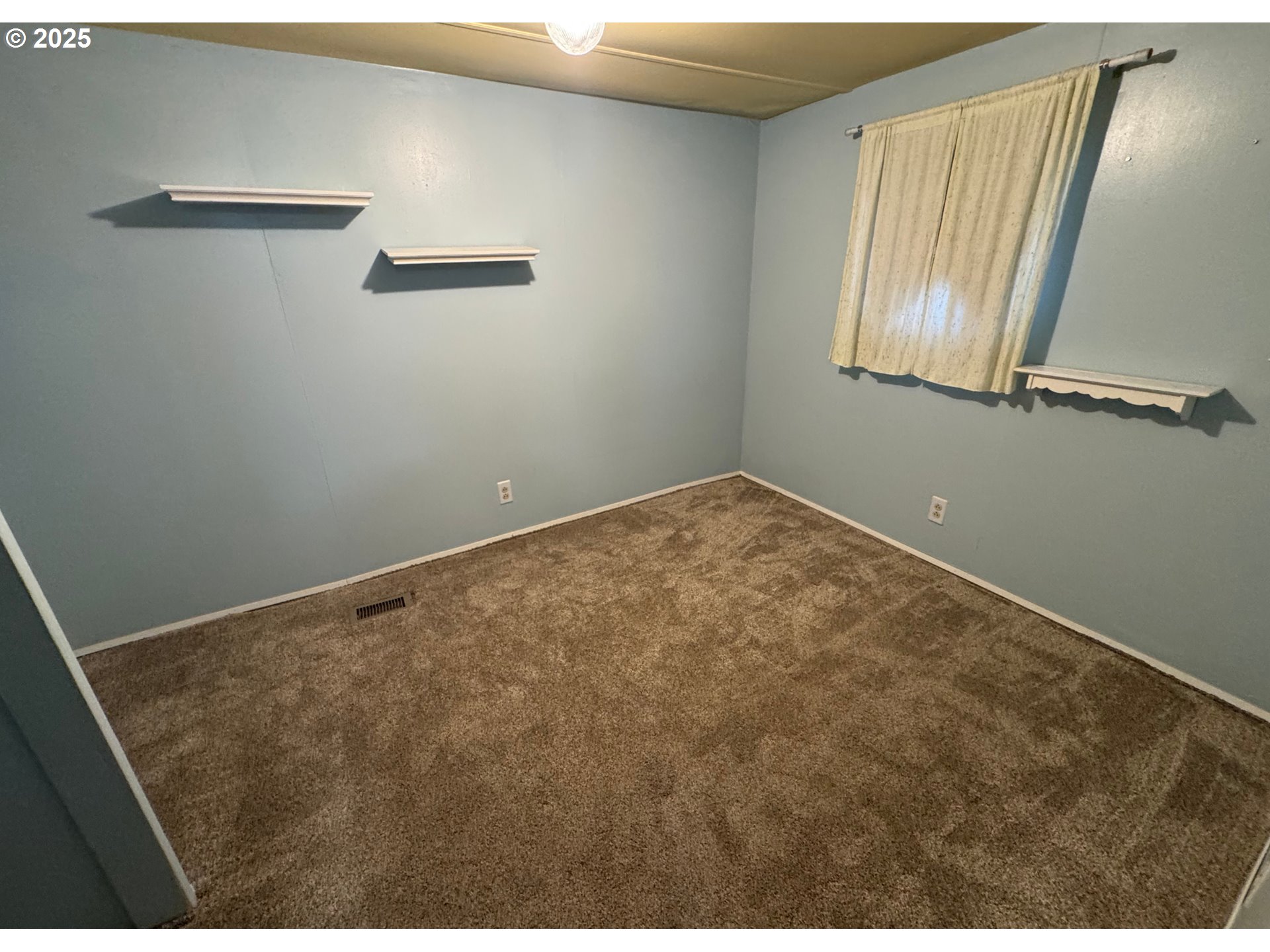 1215 Southwest 11th Street, Unit 112 Hermiston, OR 97838 - Photo 13 of 14 a view of a room with wooden floor and windows