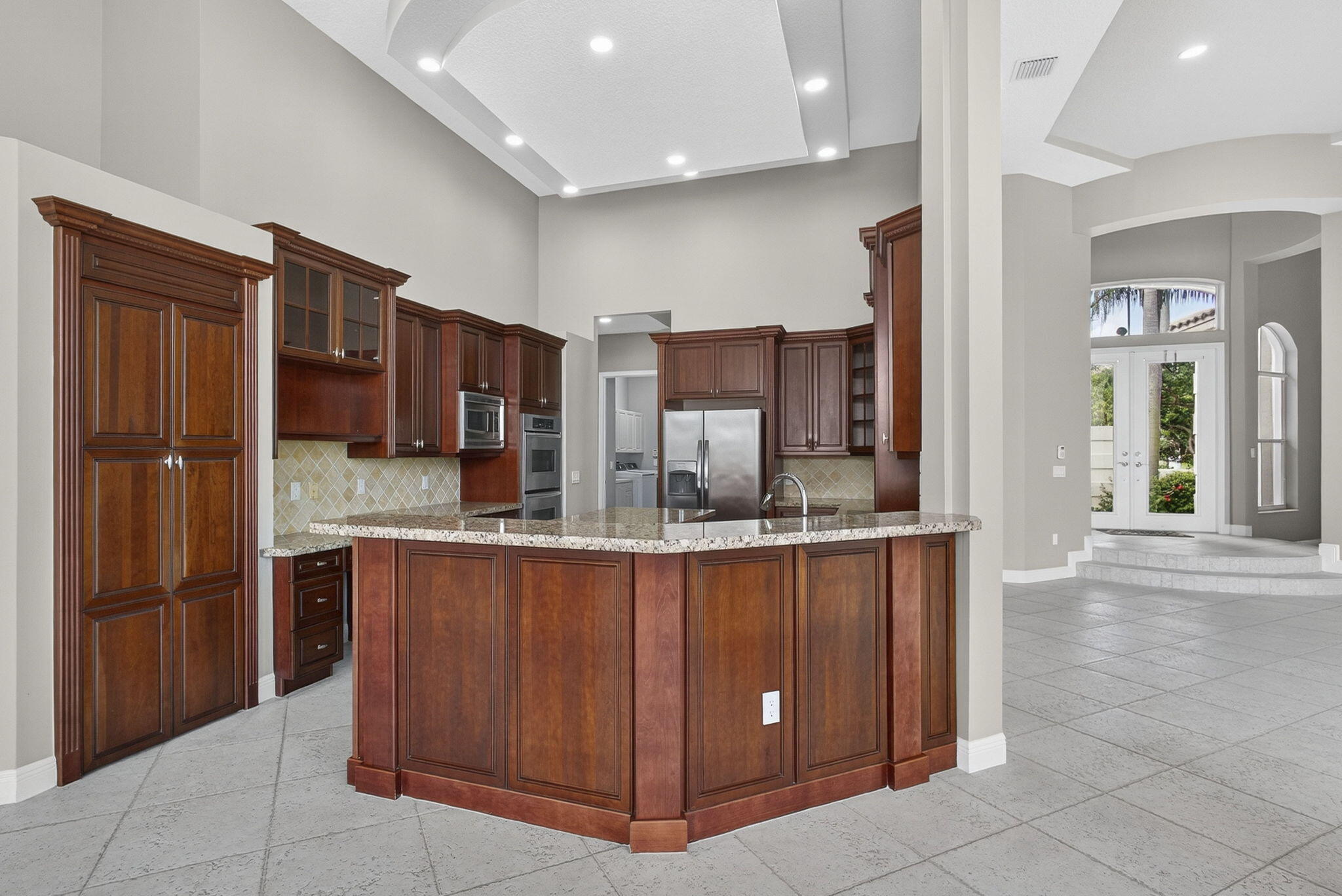 2162 Stotesbury Way Wellington, FL 33414 - Photo 13 of 41 a kitchen with stainless steel appliances granite countertop a refrigerator and a sink