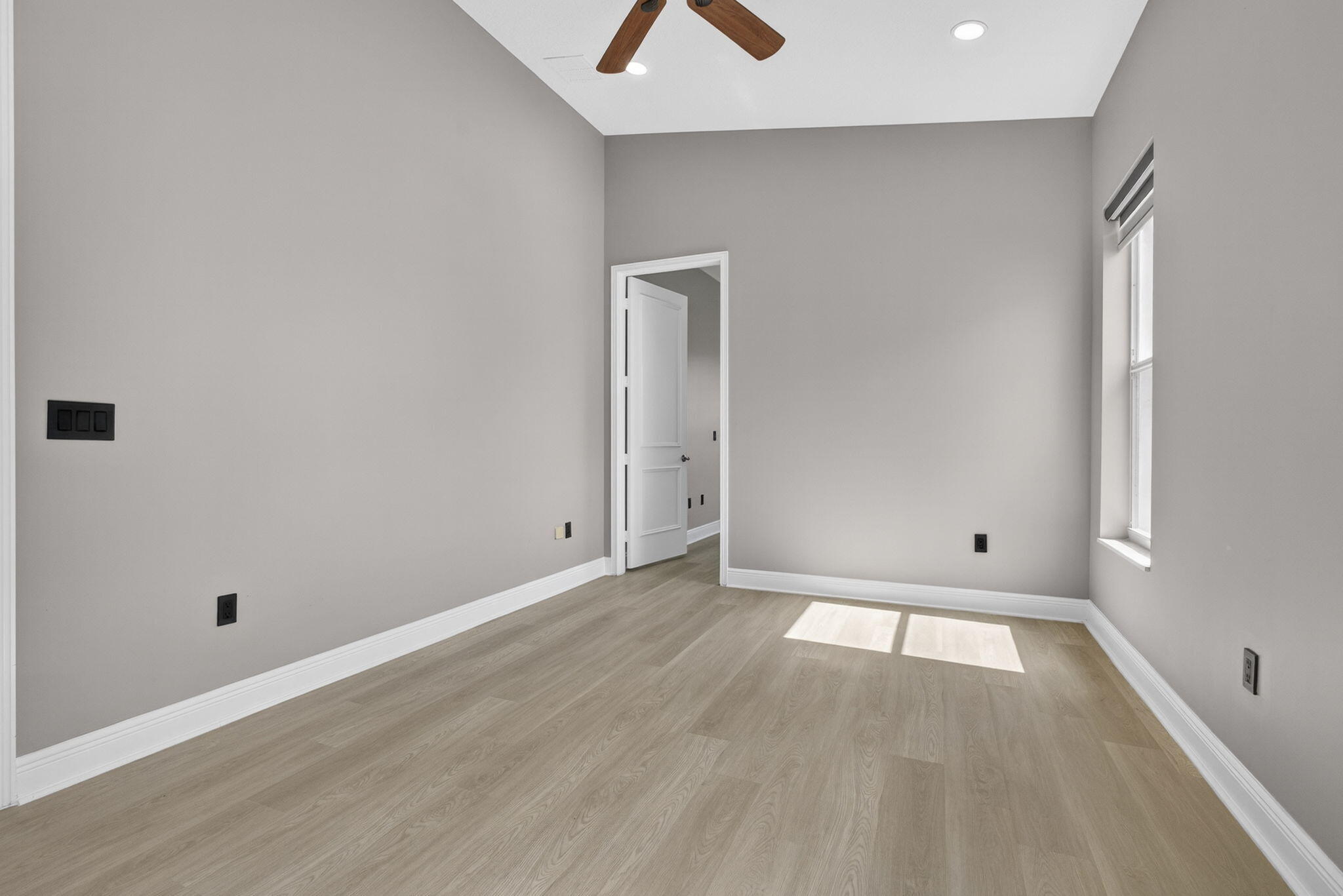 2162 Stotesbury Way Wellington, FL 33414 - Photo 20 of 41 an empty room with wooden floor and windows