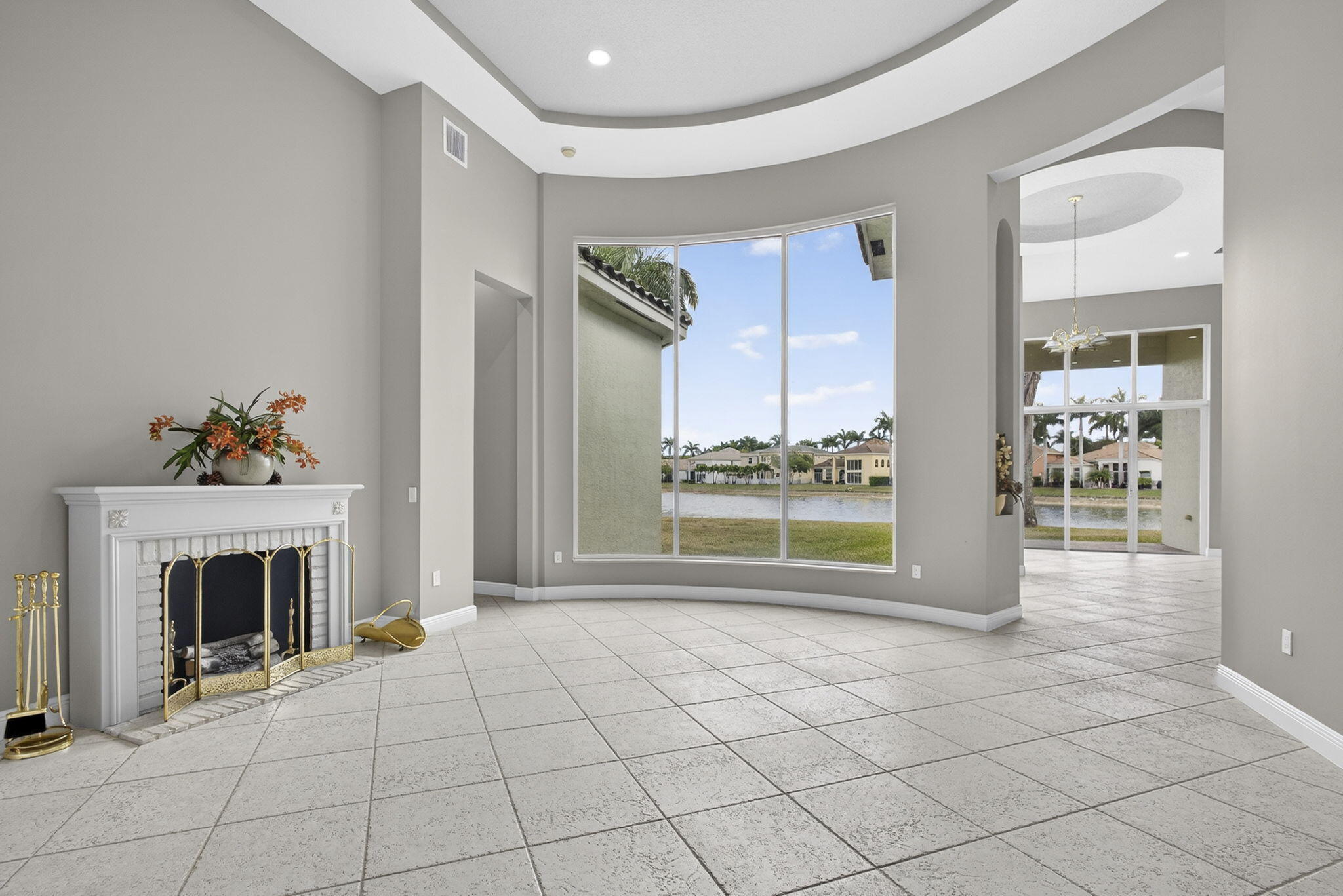 2162 Stotesbury Way Wellington, FL 33414 - Photo 3 of 41 a view of an empty room with glass door and fire place