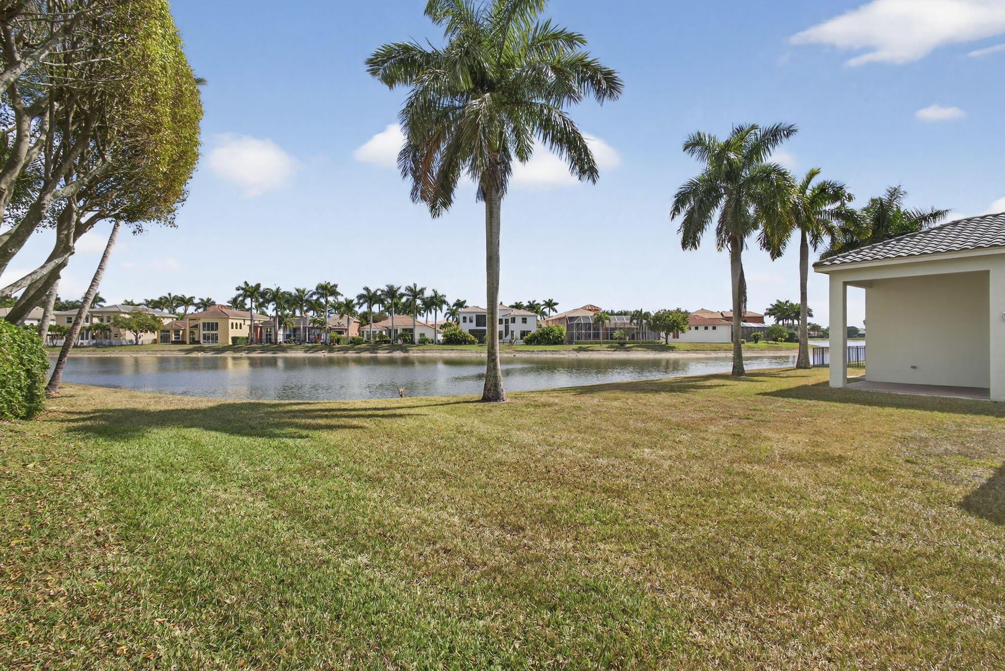 2162 Stotesbury Way Wellington, FL 33414 - Photo 33 of 41 a view of lake with palm trees