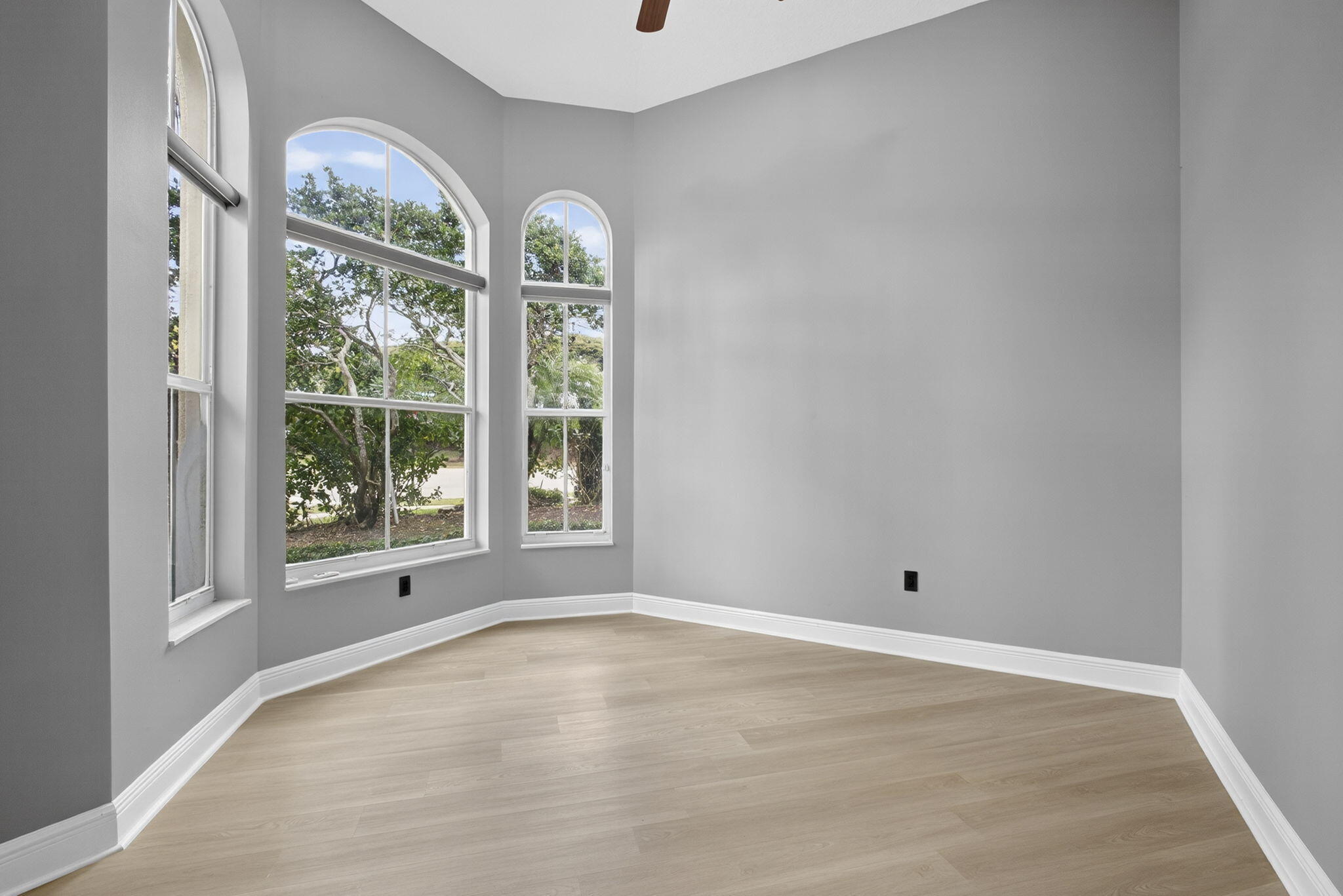 2162 Stotesbury Way Wellington, FL 33414 - Photo 8 of 41 wooden floor in an empty room with a window