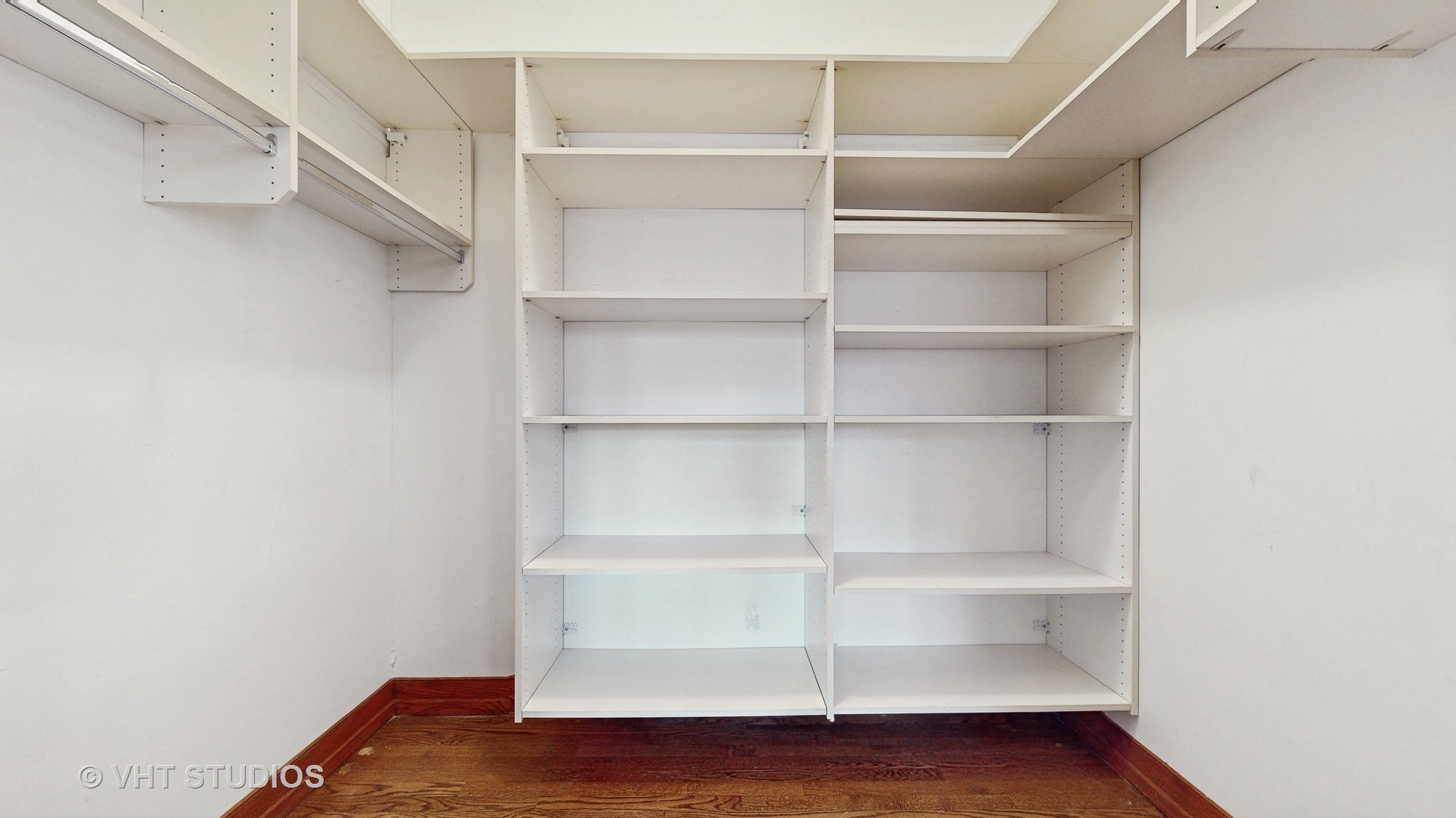 3814 North Janssen Avenue Chicago, IL 60613 - Photo 21 of 56 a view of walk in closet with empty racks