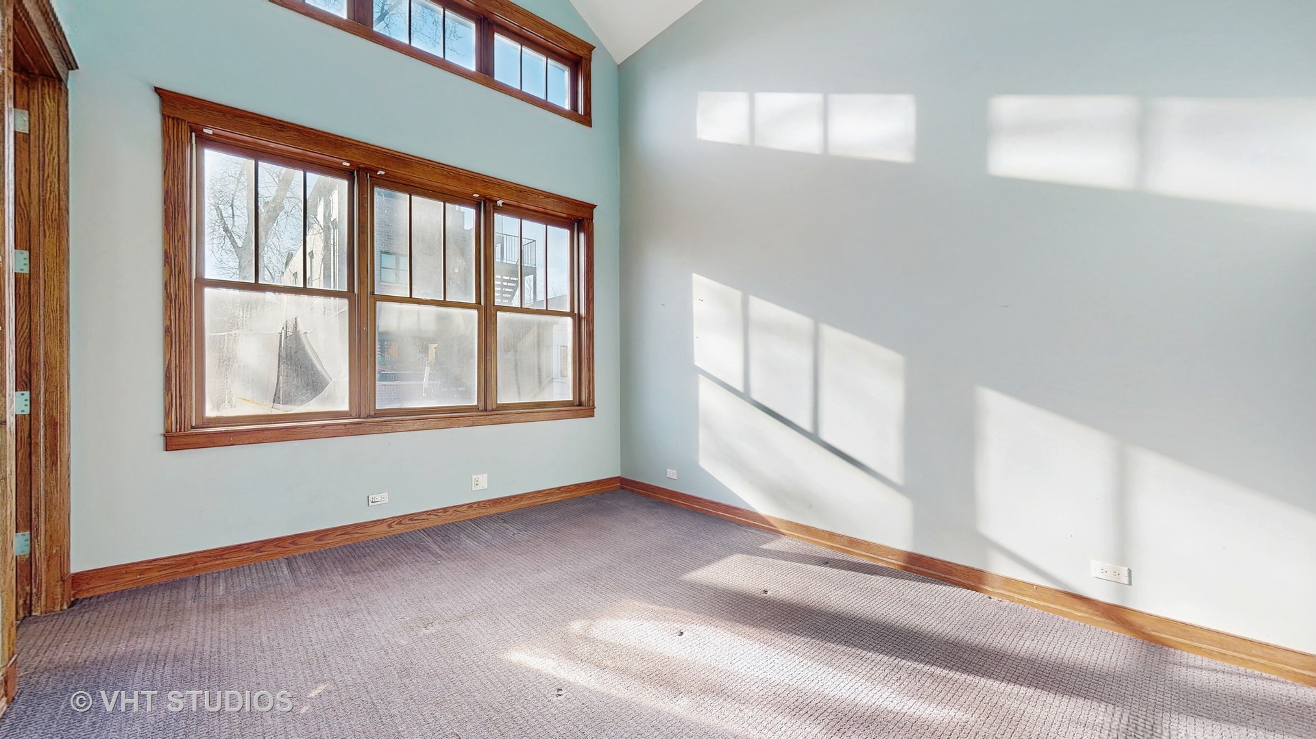 3814 North Janssen Avenue Chicago, IL 60613 - Photo 30 of 56 a view of an empty room with a window