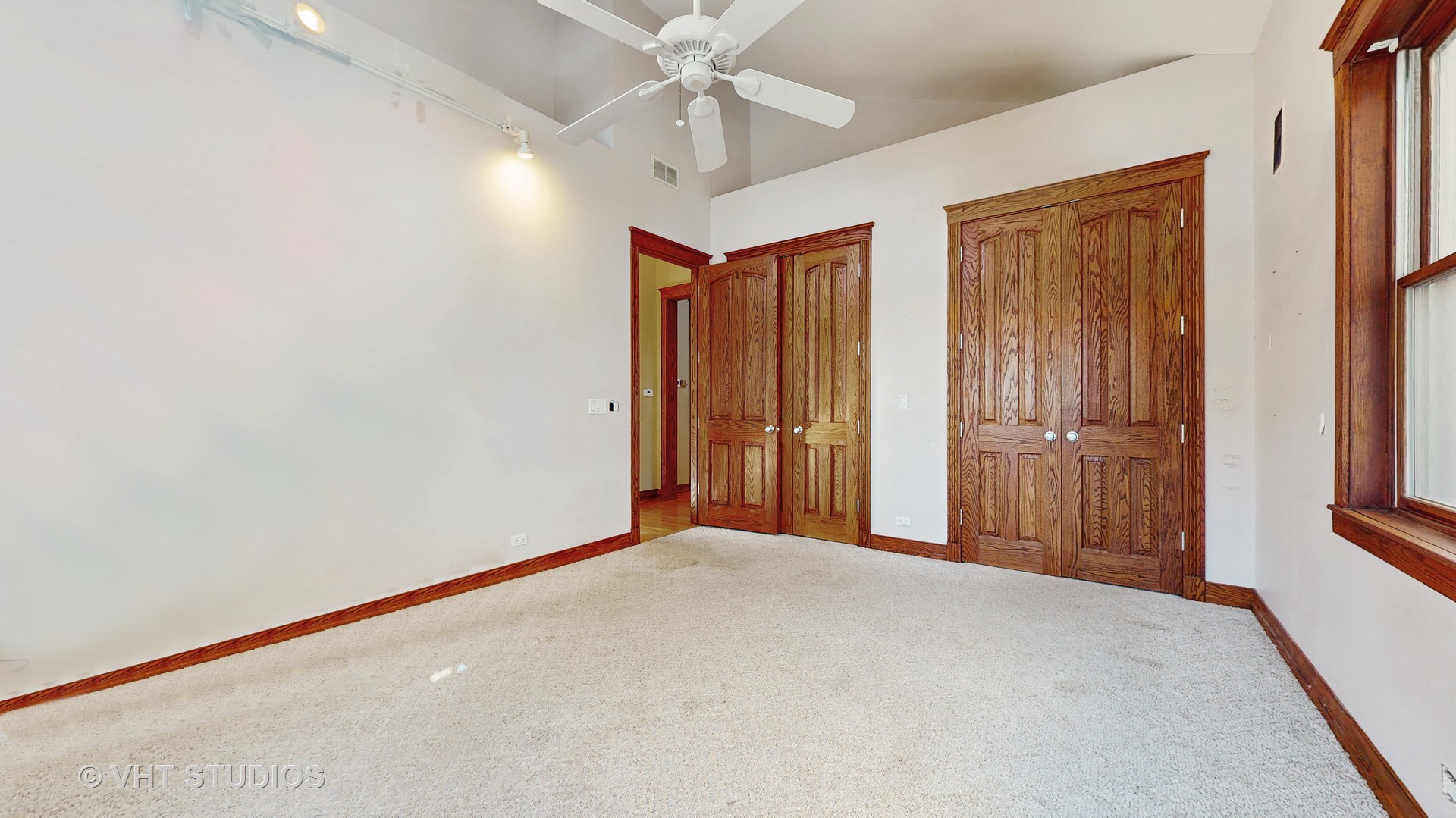 3814 North Janssen Avenue Chicago, IL 60613 - Photo 36 of 56 an empty room with windows and fan