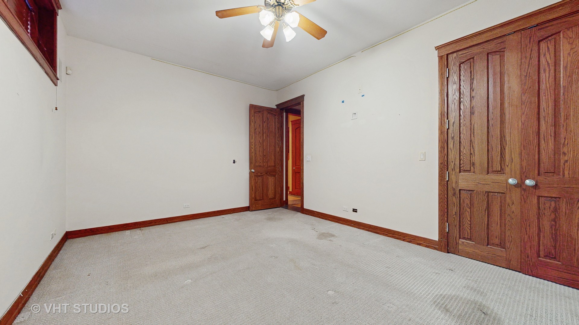 3814 North Janssen Avenue Chicago, IL 60613 - Photo 43 of 56 an empty room with chandelier fan