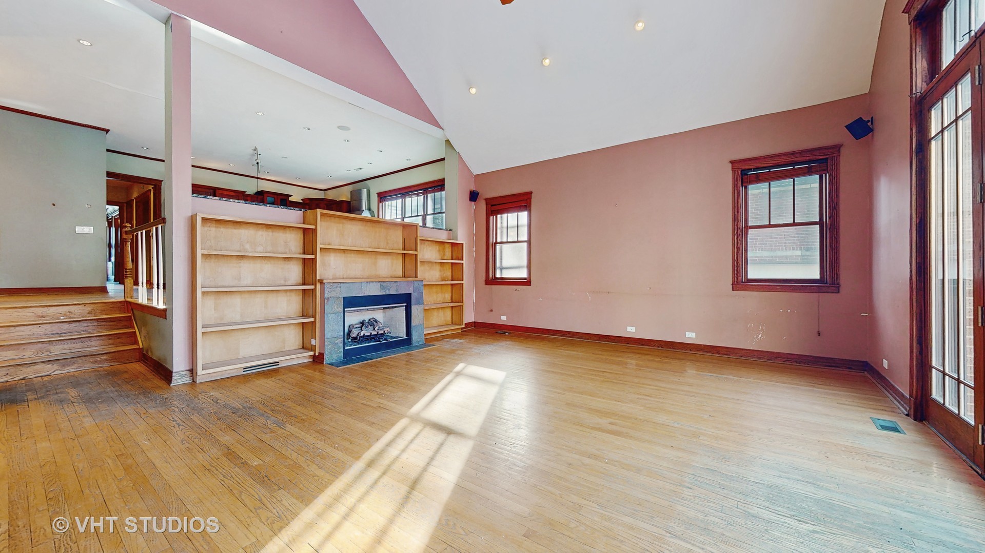 3814 North Janssen Avenue Chicago, IL 60613 - Photo 7 of 56 a view of a big room with wooden floor windows and entryway