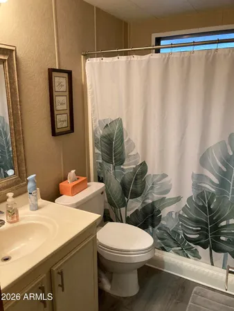 a bathroom with a toilet and a sink