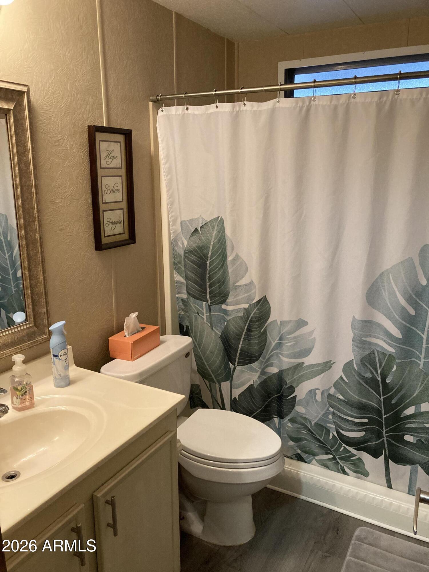 3104 East Broadway Road, Unit 203 Mesa, AZ 85204 - Photo 16 of 24 a bathroom with a toilet and a sink